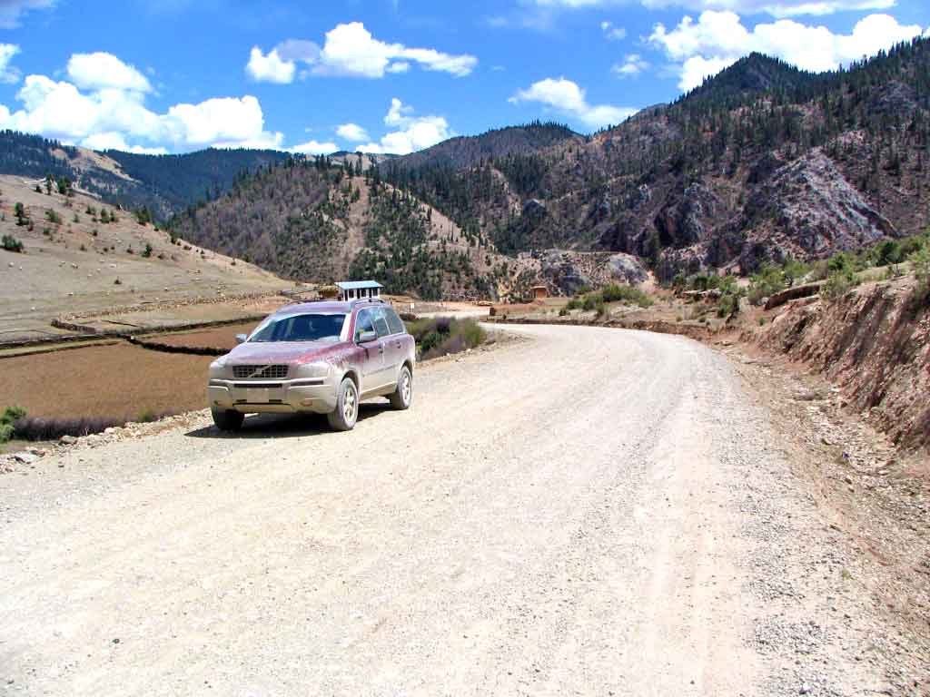 Mud-Caked Car On The Road To Batang